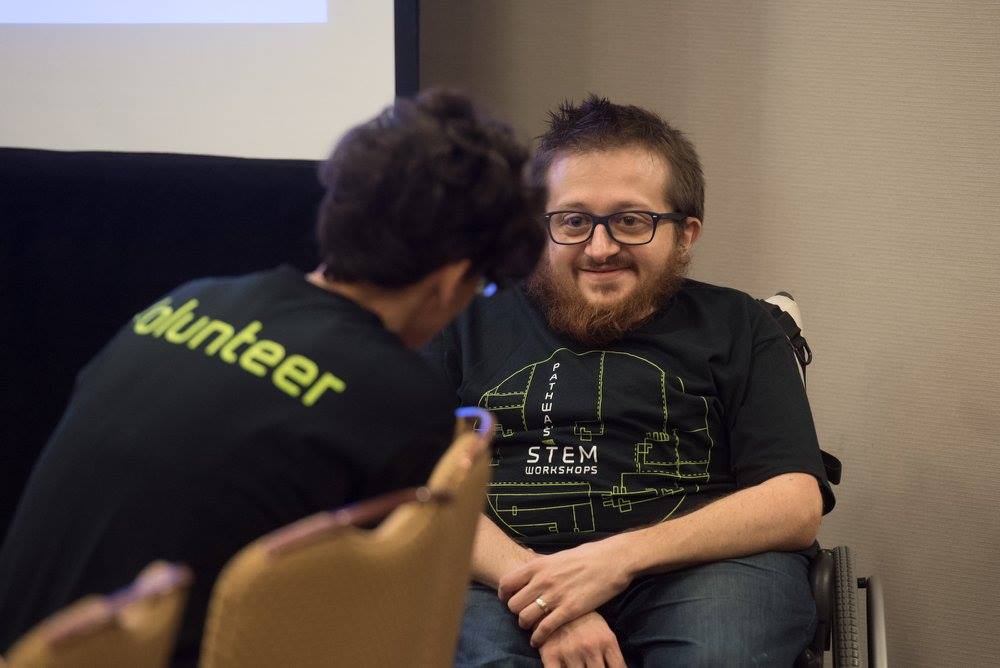 Robert Parke and a volunteer chatting
