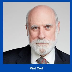 A man with a white beard and mustache wearing a dark suit, white shirt, and patterned tie, facing forward against a light background. Text below reads "Vint Cerf," honoring him among Innovators in Computing.
